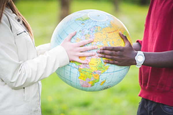 multiracial-teen-couple-holding-globe-map-2025-01-08-03-58-34-utc (1)